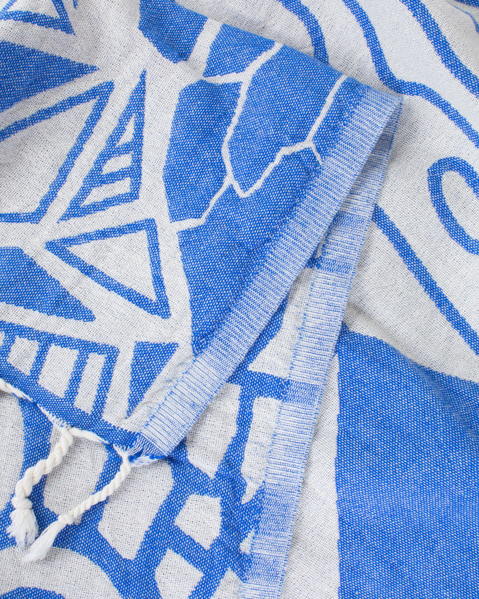 A Cloud Watching Turkish Towel by Cognitive Surplus, with designs on it.