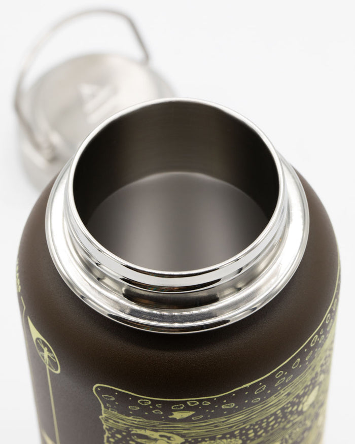 A Cognitive Surplus Core Sample 32 oz Steel Bottle with a lid and handle.