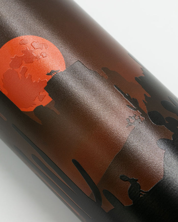 A Cognitive Surplus Desert Moon 18 oz Steel Bottle with an image of a sunset on it.