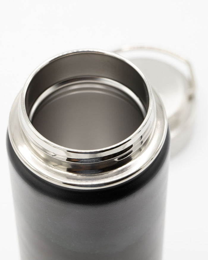 A Firefly Meadow 18 oz Steel Bottle with a lid on a white background by Cognitive Surplus.
