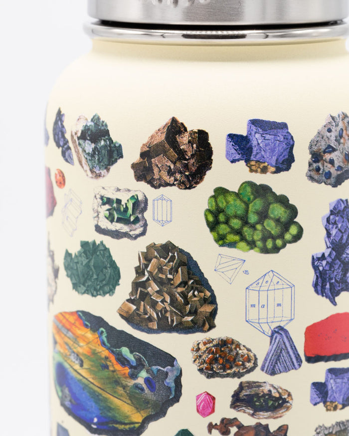 A Cognitive Surplus Gems & Minerals 32 oz Steel Bottle with a variety of rocks and minerals on it.