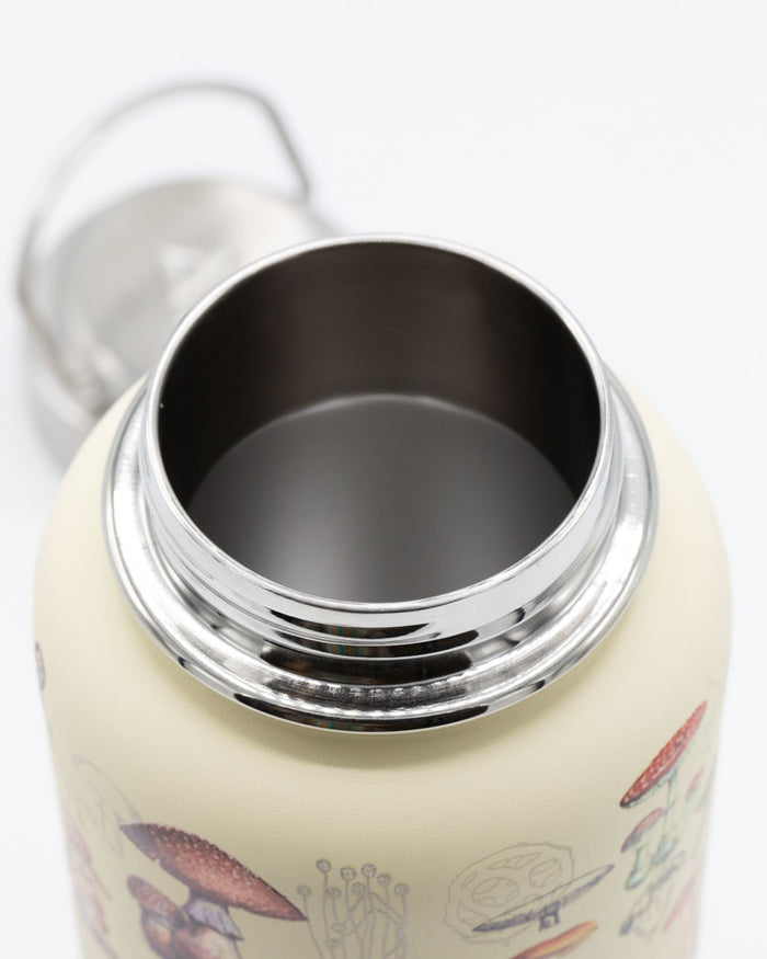 A Cognitive Surplus 32 oz Steel Bottle with a lid and mushrooms on it.