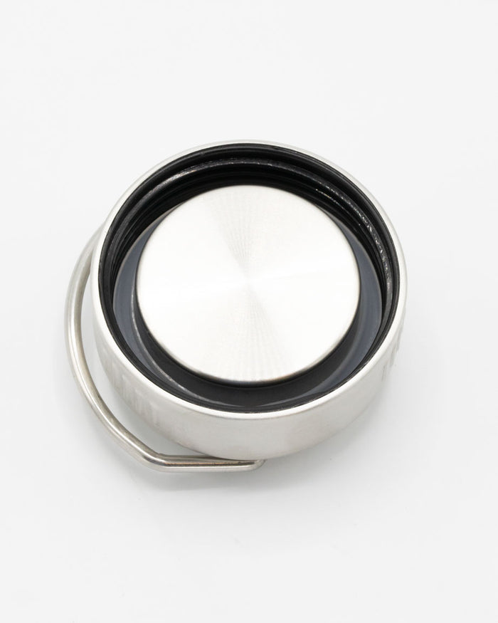 A Retro Birds 18 oz Steel Bottle button on a white surface, by Cognitive Surplus.