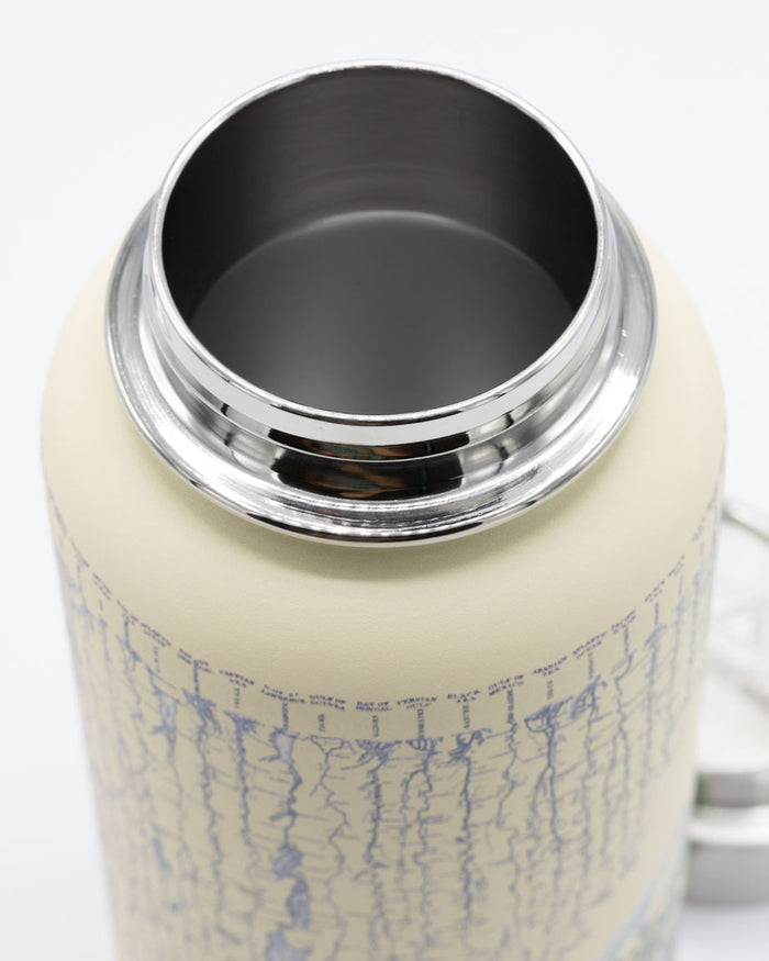 A Rivers & Mountains 32 oz Steel Bottle by Cognitive Surplus with a lid and a map on it.
