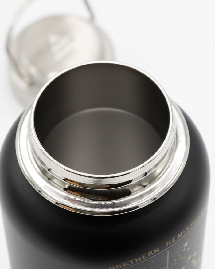 A Cognitive Surplus Star Chart 32 oz Steel Bottle with a lid.
