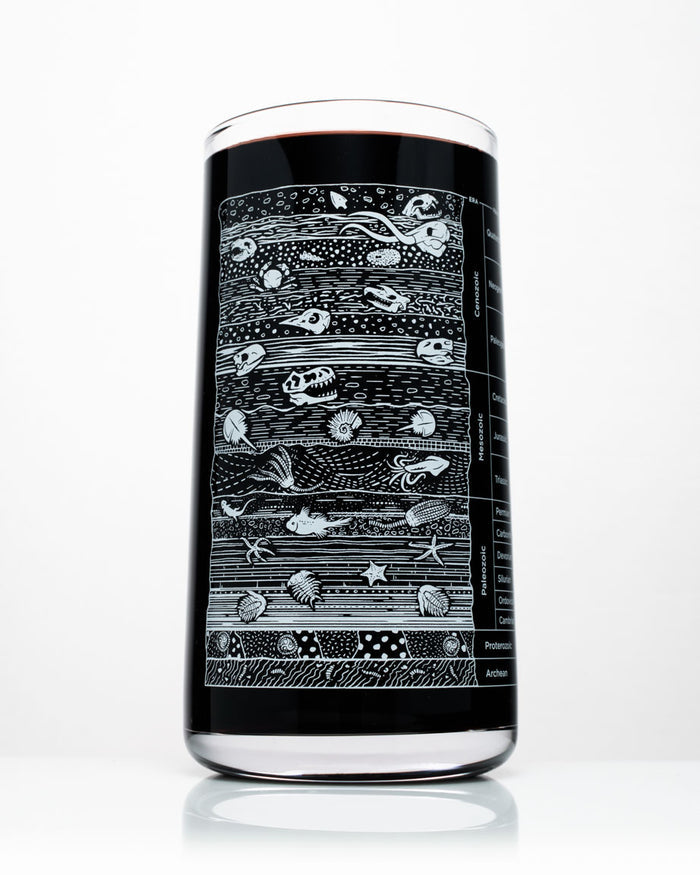 A Stratigraphy Core Sample Drinking Glass by Cognitive Surplus with a black design on it.
