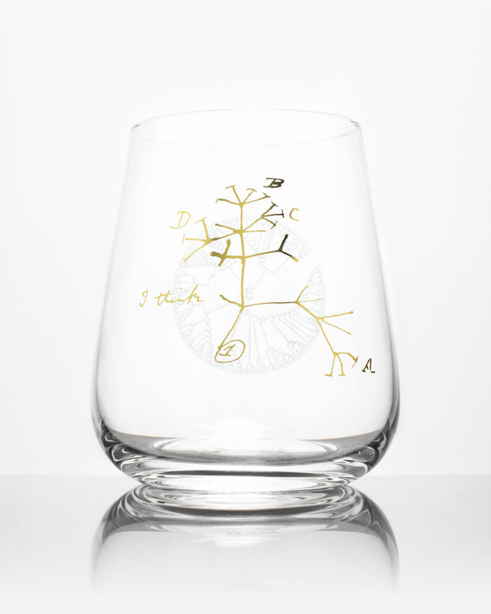 A Tree of Life Wine Glass with a gold tree design on it, by Cognitive Surplus.